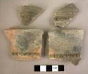 4 Fragments of pottery storage jars with plastique band at base of rim, cut vert