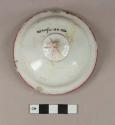 Pink hand painted overglaze whiteware lid with molded finial