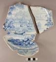 Blue transfer printed pearlware bowl with tall footring; stamped maker's mark on base: "Chinese Scenery / M / Opaque China". Two sherds crossmend