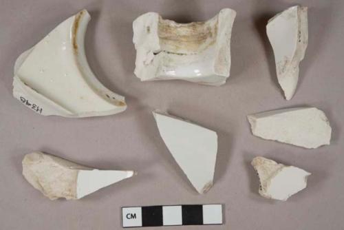 White undecorated lead glazed ironstone or vitrified earthenware vessel fragments, white paste, likely bathroom furnishings