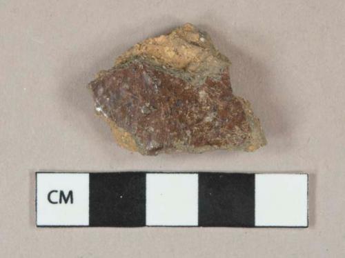 Brown salt glazed stoneware fragment, heavy and visible temper, reddish paste, likely sewer pipe fragment