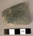 Blackish polished slate celt fragment