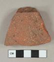 Red brick tile fragment, visible temper, possible roof tile