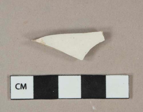 Undecorated lead glazed whiteware vessel body fragment, white paste