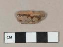 Dark brownish red lead glazed redware vessel body fragment