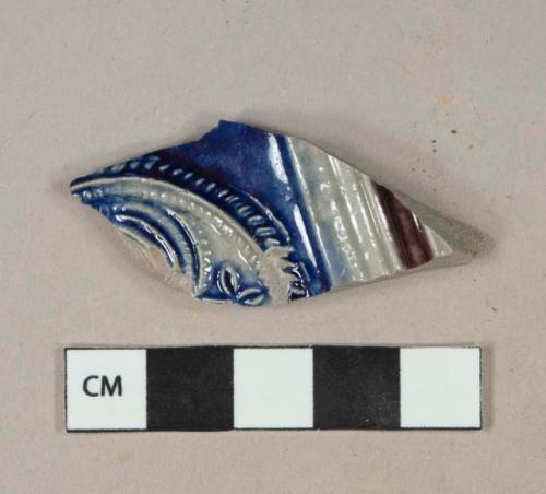 Gray salt-glazed stoneware vessel body fragment with cobalt and manganese decoration, molded decoration, gray paste, Westerwald type