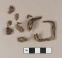 Iron buckle fragment; unidentified iron fragments
