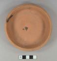 Unglazed, undecorated redware dish