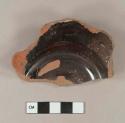 Undecorated black glazed redware base sherd