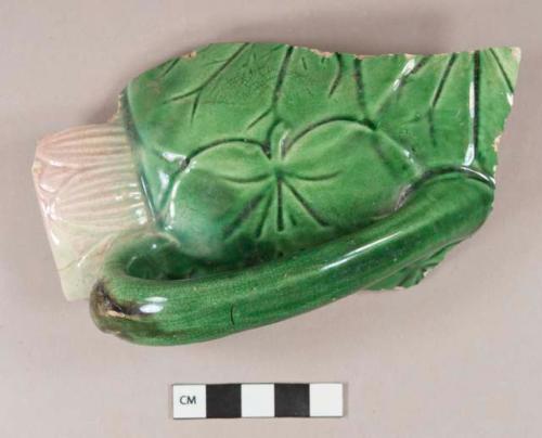 Green and pink molded majollica rim and handle sherd