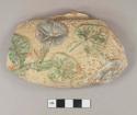 Green, yellow, and silver painted redware body sherd, molded with leaves, vines, and flowers