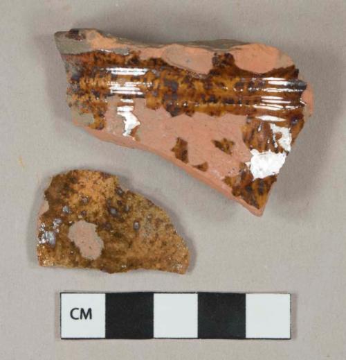 Reddish brown mottled lead glazed red ware vessel body fragments