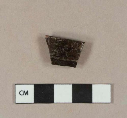 Undecorated lead glazed redware handle sherd