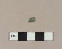 Molded copper alloy fragment, possibly fragment of a button cover