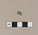 Molded copper alloy fragment, possibly a fragment of a button cover
