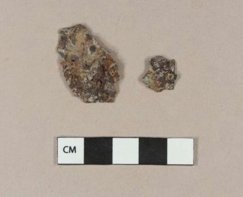 Ferrous metal sheet fragments, possibly shaped, possibly decorative objects