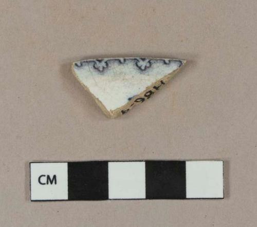 Blue tinted, purple transfer printed whiteware rim sherd