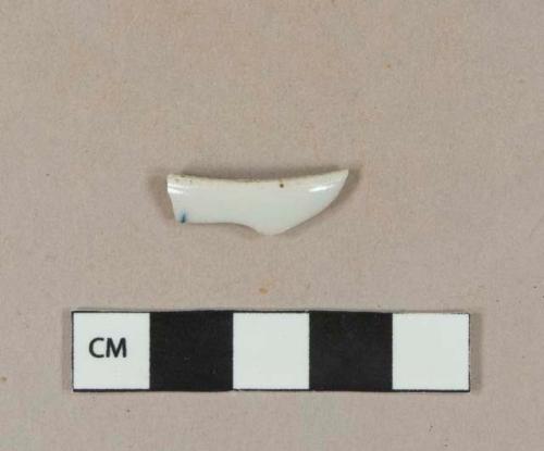 Blue hand painted porcelain rim sherd (could also be a footring)