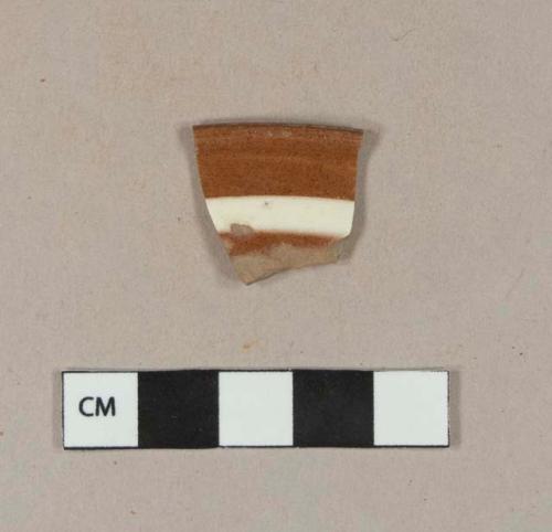 Astbury-type earthenware rim sherd with white slipped stripe decoration