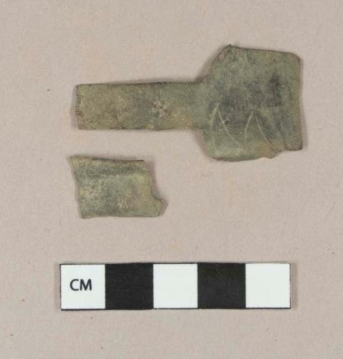 Copper alloy sheet fragments, two fragments crossmend