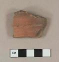 Unglazed redware rim sherd with incised lines