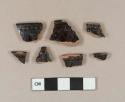 Undecorated lead glazed redware rim sherds; two sherds crossmend