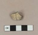 Smoked pipe bowl fragment with stamped, possible floral decoration