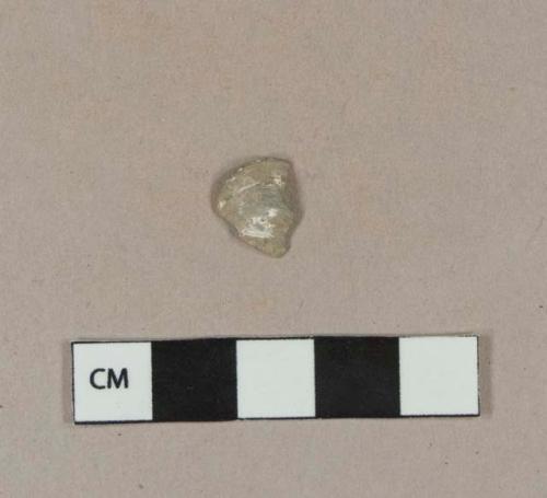 White metal object fragment, possible button cover