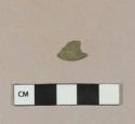 Stamped copper alloy button cover fragment