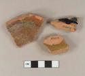 Undecorated lead glazed redware base sherds