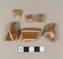 Slip decorated lead glazed redware rim sherds