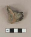 Undecorated lead glazed redware body and handle sherd