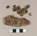 Unidentified flat iron object; iron fragments that have fallen off the main object
