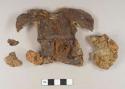 Decorative iron hinge, three fragments crossmend; unidentified iron fragments