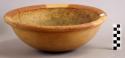 Large Red and Buff bowl with incised lineal motif on buff part of rim.