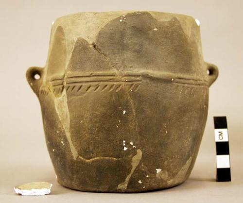 Cast of a small urn--similar in style to 713-- with horizontal band of incised d