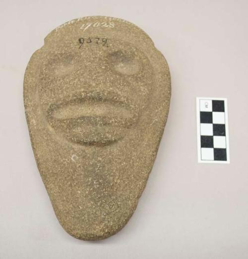 Oval Stone with human face