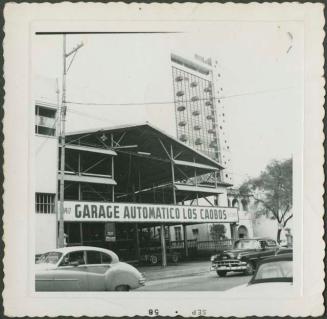 Photograph album, Yaruro fieldwork, p. 1, photo 2, urban street scene, "Garage Automatico Los Caobos"