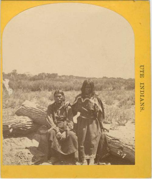 Ute Indians Sitting on a Log