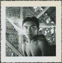Photograph album, Yaruro fieldwork, p. 13, photo 2, Yaruro man under thatched roof