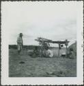 Photograph album, Yaruro fieldwork, p. 23, photo 1, people cooking by fire