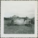 Photograph album, Yaruro fieldwork, p. 23, photo 3, people cooking by fire