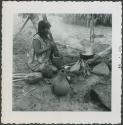 Photograph album, Yaruro fieldwork, p. 23, photo 4, close view of woman cooking