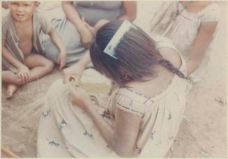 Photograph album, Yaruro fieldwork, p. 31, photo 1, young girl wearing hair comb