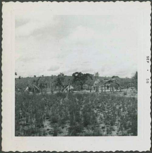 Photograph album, Yaruro fieldwork, p. 32, photo 1, wooden structures in the background
