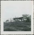 Photograph album, Yaruro fieldwork, p. 32, photo 2, wooden structures with thatched roofs