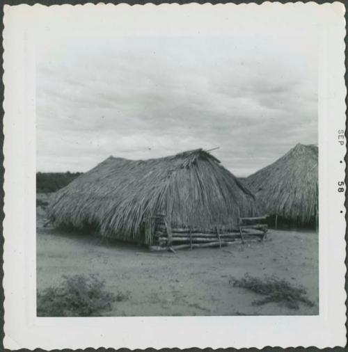 Photograph album, Yaruro fieldwork, p. 33, photo 1, wooden structure with thatched roof