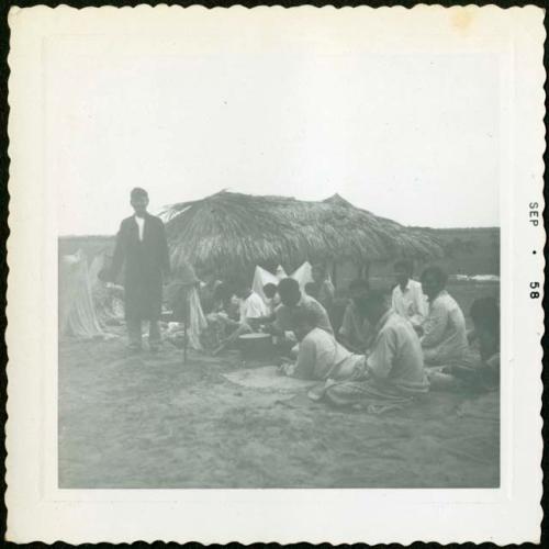 Photograph album, Yaruro fieldwork, p. 58, photo 1, people sitting around