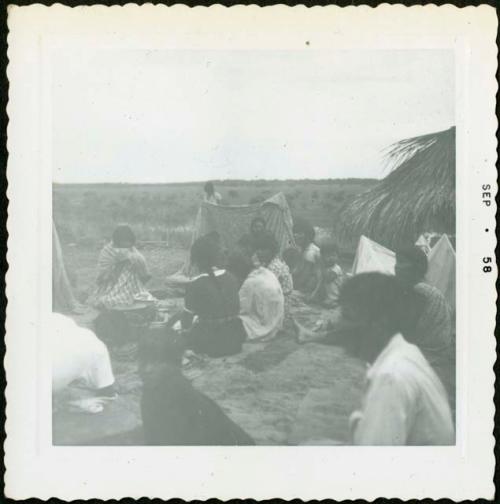 Photograph album, Yaruro fieldwork, p. 58, photo 2, people sitting around