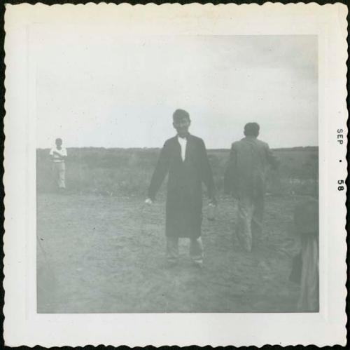 Photograph album, Yaruro fieldwork, p. 58, photo 3, man in black outdoors
